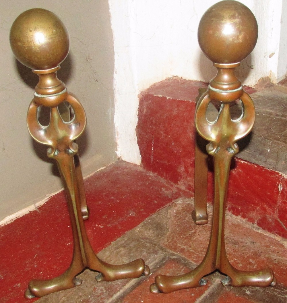 interesting pair of arts crafts andirons fire dogs